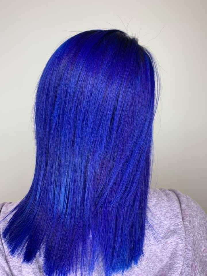 Vibrant blue hair in a straight, shoulder-length style.