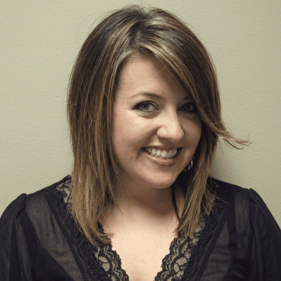 Portrait of Katy, a professional stylist at Hair Sculptors Salon & Spa, showcasing their expertise and style.