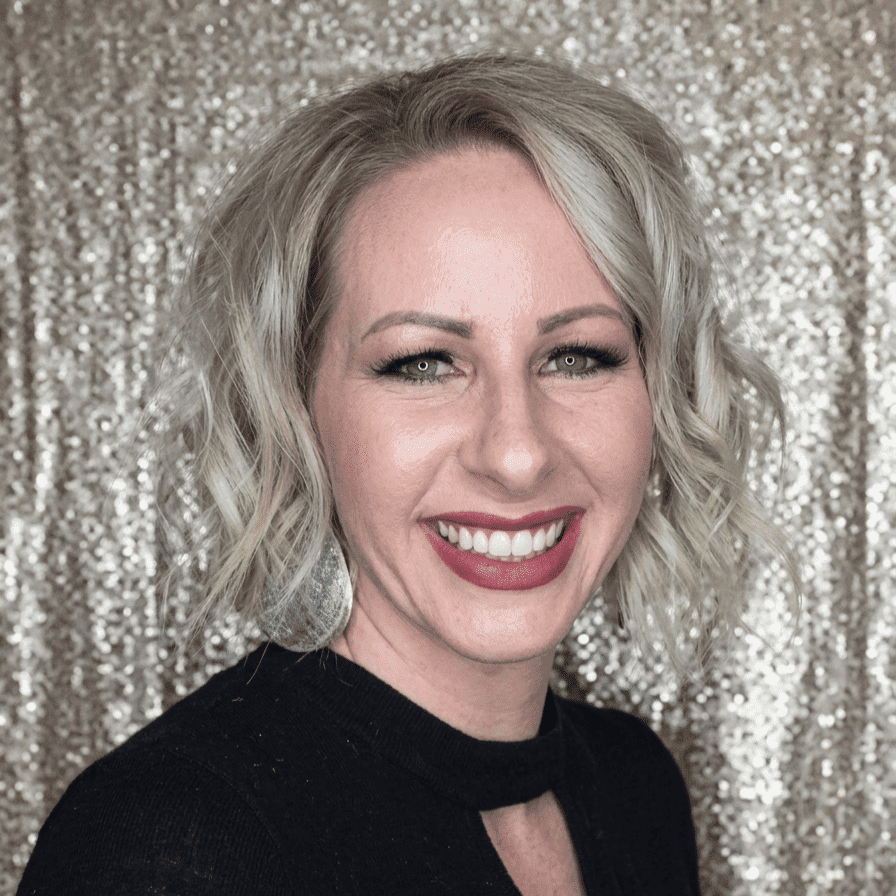 Portrait of Lyn, a professional stylist at Hair Sculptors Salon & Spa, showcasing their expertise and style.