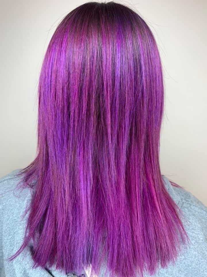 Purple and pink hairstreaks on straight medium-length hair.