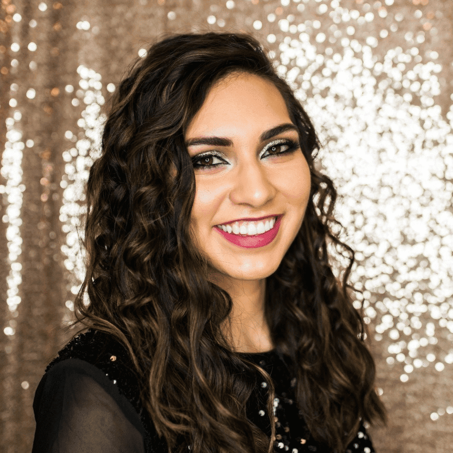 Portrait of Stacy, a professional stylist at Hair Sculptors Salon & Spa, showcasing their expertise and style.