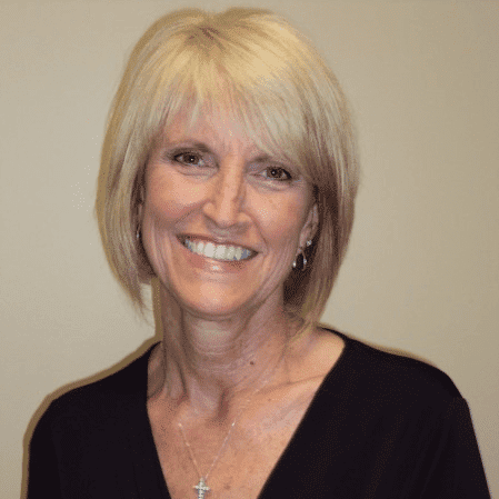 Portrait of Mary Shaw, a professional stylist at Hair Sculptors Salon & Spa, showcasing their expertise and style.